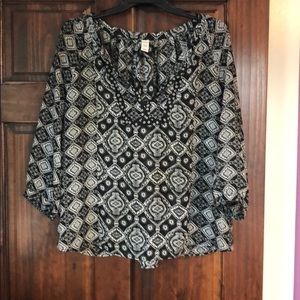 Gray and black V neck blouse.